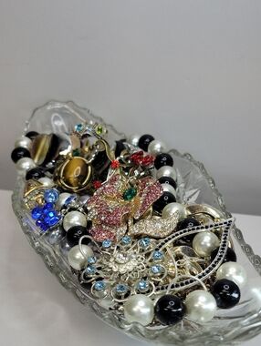 Glass Dish Filled With Assorted Jewelry